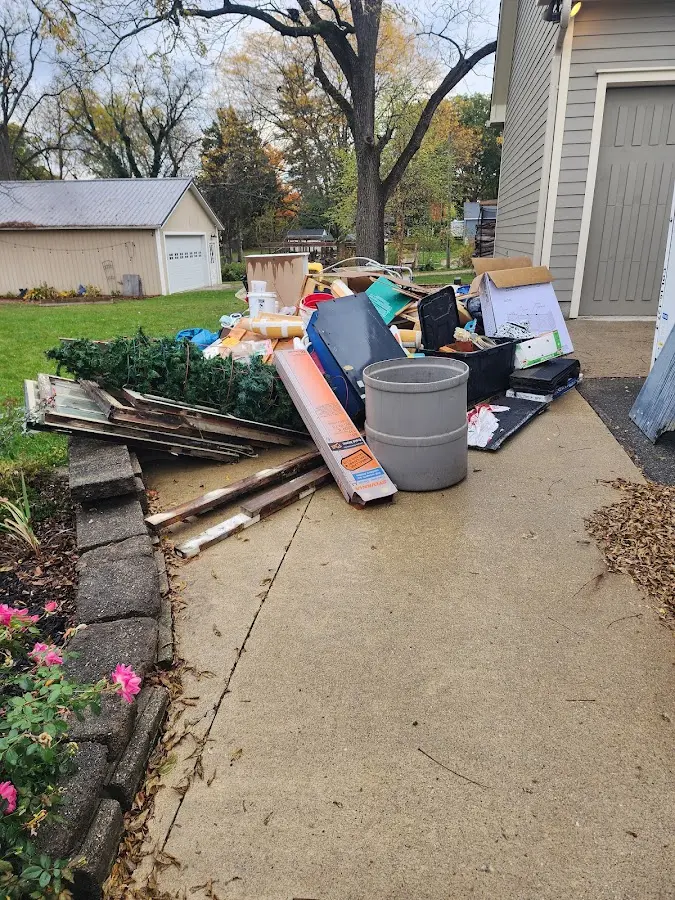 Dumpster being loaded with debris for Estate Cleanout Dumpster Rental in Kent
